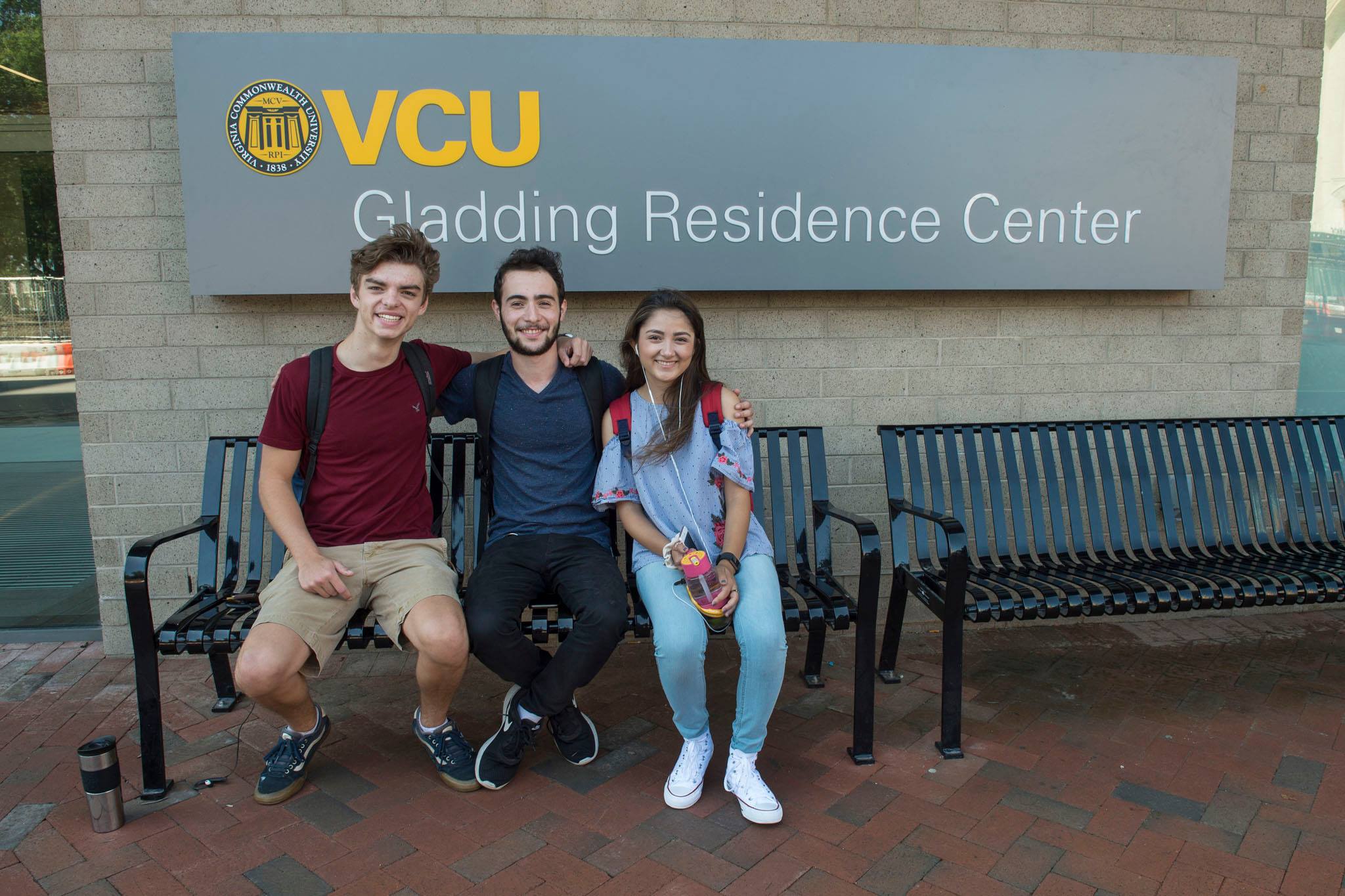 Students sitting on bench outside GRC